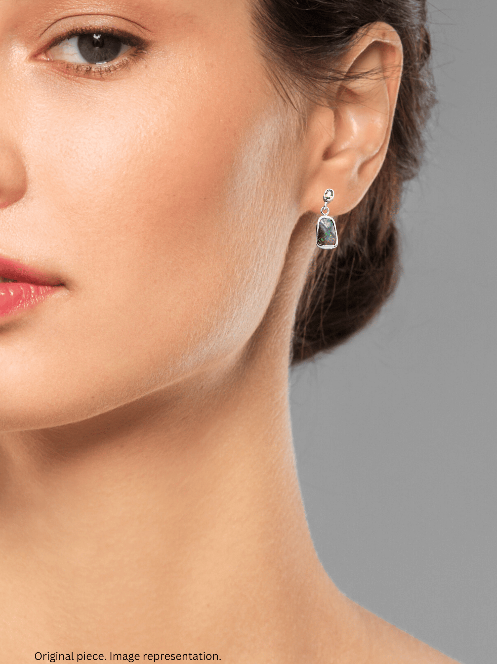 Australian Boulder Opal Drop Silver Earrings with Bright Green Sapphires on model