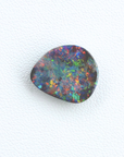 Multicolored opal stone on a white background