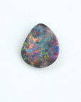 Multicolored opal stone on a white background